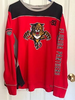 Vintage 1990s Starter/CCM-era Florida
Panthers long-sleeve red hockey warm-up